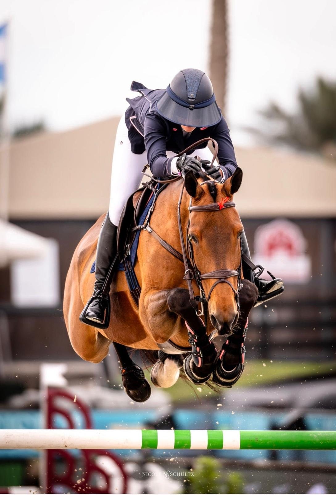 Tight action shot over a vertical.